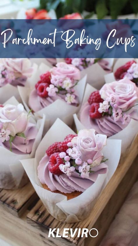 Light and fluffy cupcakes featuring Lilac Themed pretty Cupcake decorations displayed in parchment baking cups topped with  blueberry buttercream, lilac colored edible rose prop , berries and tiny edible flowers. Wedding Cupcake Frosting, Cute Wedding Cupcakes, Special Cupcakes Ideas, Fancy Cupcakes Wedding, Wedding Day Cupcakes, Cupcakes In Tulip Liners, Tulips Cupcakes, Cupcake Presentation Ideas, Wedding Muffins