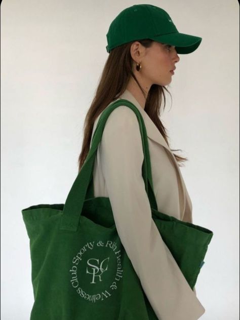 model wearing cream blazer and green baseball cap with green sporty and rich shopper bag Sporty And Rich Aesthetic, Rich Outfits, Emily Oberg, Pretty Tote Bags, Canvas Bag Design, Rich Clothes, Sporty And Rich, July 12, Sporty Outfits