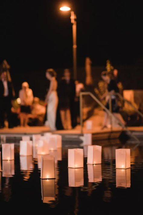 20 Halloween-Themed Wedding Ideas That Are Stylishly Spooky Pool Party Decoration Ideas, Floating Candles In Pool, Candles In Pool, Wedding Pool Party Decorations, Backyard Wedding Pool, Water Volleyball, Wedding Lighting Ideas, Pool Decorations, Pool Lighting