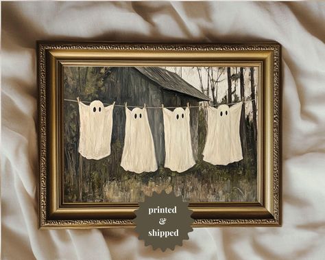 This vintage style painting shows ghosts on a clothesline at a country farmhouse. Perfect for cottage and country Halloween decor. THIS IS A PHYSICAL PRINT THAT WILL BE SHIPPED TO YOU. If you're looking for an affordable digital download version of this print, check out our listing no. 103:  https://cozycottagewallart.etsy.com/listing/1769654420 ------------------------------------------------------------------------ Printed on thick and long-lasting matte (uncoated) museum quality paper. - Pape Ghost Painted On Old Paintings, Affordable Halloween Decor, Thrift Fall Decor, Thrift Halloween Decor, Cute Spooky Paintings Easy, Halloween Painting Ghost, Spooky Ghost Painting, Halloween Chic Decor, Thrifted Halloween Painting