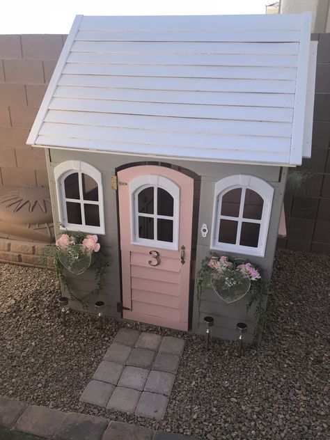 DIY painting project for my daughters playhouse. Came in cedar wood and painted with 3 colors: Pink, Grey & White. Added heart mesh metal flower boxes with silk peonies and artificial vines. Walkway is with 3x3 paver bricks. Playhouse Paint Ideas, Playhouse Redo, Playhouse Inspiration, Playhouse Remodel, Playhouses For Kids, Pink Playhouse, Wooden Outdoor Playhouse, Outdoor Playhouses, Shed Playhouse