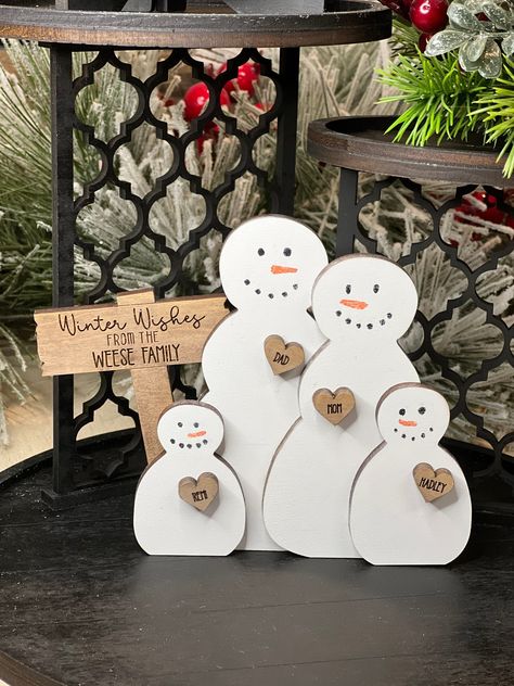 "This adorable Snowman Family will make a great addition to your winter decor. Personalize with your own family names. Perfect Size for a small shelf or tiered tray. Approximately 5\" tall. Width depends on how many snowmen. Thanks so much for shopping at SweetLoveBlooms and have a blessed day!" Snowmen Ideas, Snowman Christmas Decor, Farmhouse Winter Decor, Let It Snow Snowman, Snowman Crafts Diy, Wooden Snowmen, Tray Decoration, Snowman Sign, Snowman Decor