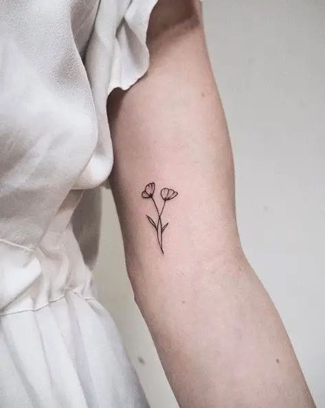 The Best 32 Bicep Tattoo For Women Every Artist Approves - Psycho Tats Inside Bicep Tattoo Women Simple, Inner Bicep Tattoo Women Flower, Under Bicep Tattoo Women, Lower Bicep Tattoo Women, Biceps Tattoo For Women, Small Bicep Tattoos For Women, Small Bicep Tattoo, Womens Bicep Tattoo, Women Bicep Tattoo