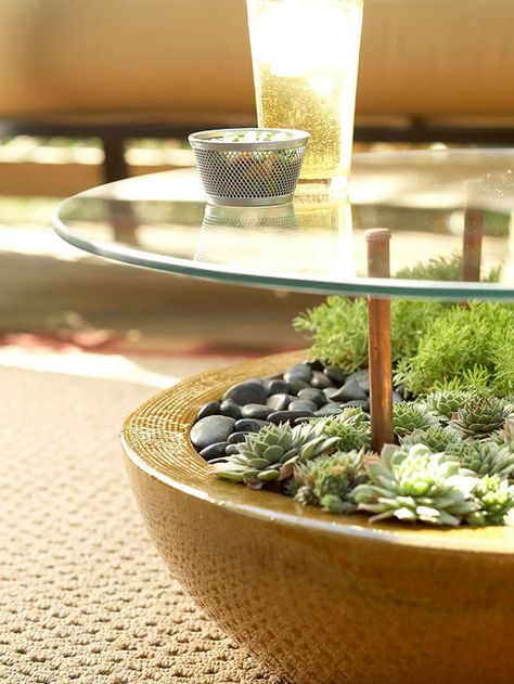 Make Furnishings Work Twice as Hard  Because space is often at a premium in outdoor living areas, furniture and accessories have to do double-duty. Benches may have storage space underneath; tables may also be containers. Here, this pretty side table features a stunning container planted with low-maintenance succulents that add color and texture under a raised tempered-glass top resting on copper supports. Table With Plants, Terrace Furniture, Planter Table, Cactus Y Suculentas, Garden Table, Patio Ideas, Succulents Garden, Outdoor Rooms, Shade Garden