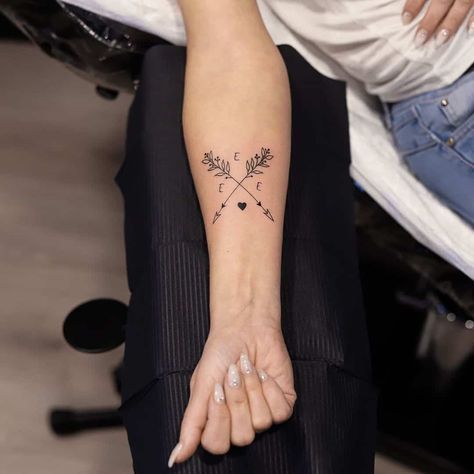 Arrow Tattoo With Name Initial Compass Initial Tattoo, Initial Tattoo On Shoulder, Daughter Initial Tattoo, Cross Arrow Tattoos For Women, Arrow Family Tattoo, 3 Initials Tattoo, Children’s Initials Tattoo, Arrow Name Tattoos For Women, Initial Tattoo For Kids