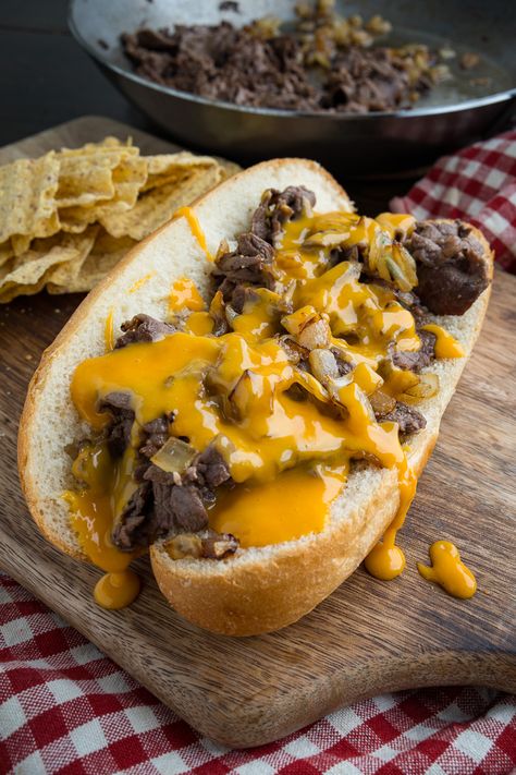 A recipe for Philly Cheesesteak Sandwiches : Tasty Philly style cheesesteak sandwiches with tender rib-eye steak, sauteed onions and plenty of cheese! Philly Cheesesteak Sandwiches, Philadelphia Cheesesteak, Cheesesteak Sandwiches, Philly Cheese Steak Sandwich, Steak Sandwich Recipes, Sauteed Onions, Philly Cheese Steak Recipe, Cheese Whiz, Steak Sandwiches