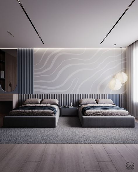 A modern design with grey and blue tones. The room has two sleek grey beds with blue bedding accents. The walls feature a trendy grey wave design and a textured panel behind the beds to offer a stylish appearance.
The use of gray and blue provides a peaceful and harmonious atmosphere.

#bedroom_design #modern_interior #home_decor #modern_bedroom_design Hospital Bedroom, Bedding Accents, Grey Beds, Behind Bed Wall Decor, Light Gray Bedroom, Blue Gray Bedroom, Beautiful Bedroom Designs, Bed Wall Decor, Kids Bedroom Design