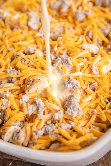 Everything Bagel Sausage & Cream Cheese Breakfast Casserole Recipe - delicious overnight #breakfast #casserole! Everything #bagels, #sausage, cream cheese, eggs, heavy cream, sour cream, and cheddar cheese. SO easy to make and tastes GREAT! Perfect for overnight guests! Can freeze unbaked for later. We love this for breakfast, lunch, or dinner! #freezermeal #tailgating #breakfastcasserole Sausage Cream Cheese Breakfast Casserole, Cream Cheese Breakfast Casserole, Everything Bagel Breakfast Casserole, Bagel Breakfast Casserole, Bagel Breakfast Bake, Mini Breakfast Casserole, Staff Meeting Ideas, Everything Bagel Breakfast, Company Breakfast