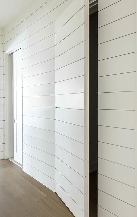 White shiplap hallway walls help to conceal a powder room behind a white shiplap jib door. Shiplap Hallway, Jib Door, Secret Door Ideas, Dold Dörr, Hidden Doors In Walls, Hidden Closet, Hallway Walls, Invisible Doors, Door Diy