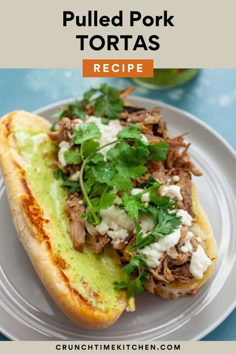 Have you had a Torta?!! It's a Mexican Sandwich that's usually filled with griddled meat, onions, and cheese, all stuffed in a soft roll. SO GOOD. I made this version with pressure cooker pulled pork and slathered it with Guacamole Salsa! crunchtimekitchen.com #tortas #pulledpork #sandwiches #mexican Pork Tortas Sandwich, Carnitas Tortas Sandwich, Carnitas Sandwich, Mexican Tortas, Tortas Sandwich, Pressure Cooker Pulled Pork, Mexican Sandwich, Mexican Salsa Recipes, Cheese All