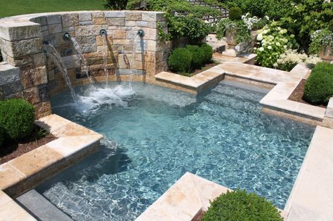 Nothing says tranquility more than this small, cross-shaped hot tub. Hot Tub Grotto, Pool With Hot Tub Waterfall, Pool Plaster Colors, Inground Hot Tub With Waterfall, Pool Waterfall Jumping Rock, Inground Pool With Hot Tub Rock Waterfall, Cabana Design, Pool Plaster, Courtyard Pool