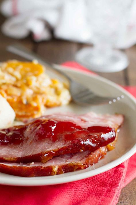 The perfect combination of sweet and savory, this Brown Sugar and Cherry Glazed Ham is glazed with a mixture of cherries, brown sugar, mustard and cinnamon. Cherry Ham Glaze, Cherry Glazed Ham, Cherry Ham, Brown Sugar Glazed Ham, Ham Sauce, Brown Sugar Ham, Ham Glaze Brown Sugar, Cherry Glaze, Taste And Tell