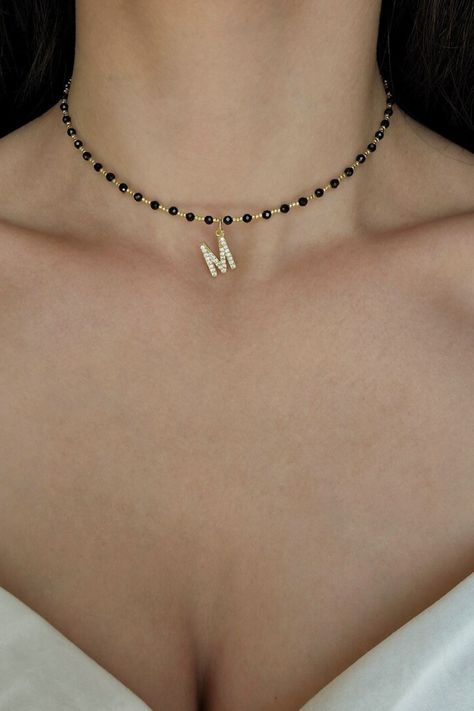 Adorn yourself with sophistication in our Black Spinel Choker Necklace. Personalized with custom name signs, this minimalist and monogrammed piece is a heartfelt "To My Daughter" necklace. Embrace the allure of a chic initial choker. #BlackSpinelChoker #CustomNameNecklace #ToMyDaughterNecklace #MonogramJewelry #MinimalistChoker #InitialCharm #BlackChokerElegance Adventure Jewelry, Spinel Jewelry, Silver Link Necklace, Japanese Jewelry, Choker Silver, Choker Black, Chunky Chain Necklaces, Monogram Jewelry, Daughter Necklace