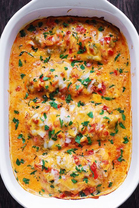 Queso Baked Chicken – chicken spiced up with Southwestern spices and smothered with chopped tomatoes, green chiles, Queso sauce, topped with Cheddar (or Monterey Jack) cheese on top. This Queso chicken bake is a great recipe for revamping your love for chicken breasts! The chicken is covered with a creamy sauce, tomatoes, green chiles and...Read More Keto Mexican Chicken, Mexican Chicken Recipes, Queso Recipe, Thighs Chicken, Smothered Chicken, Balsamic Chicken, Mexican Chicken, Chicken Spices, Baked Chicken Breast