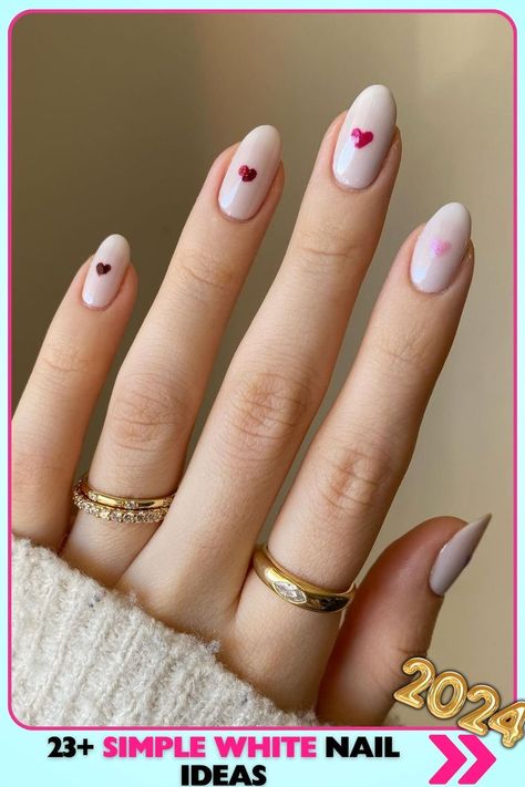 Almond-shaped white nails with heart accents, glossy finish. These sweet, medium-length simple white nails are ideal for dates and anniversaries, adding a romantic touch to your look. Simple White Nail Ideas, White Nails With Heart, Simple White Nails, White Nail Ideas, Anniversary Nails, Work Nails, White Nail, Nails 2024, Romantic Design