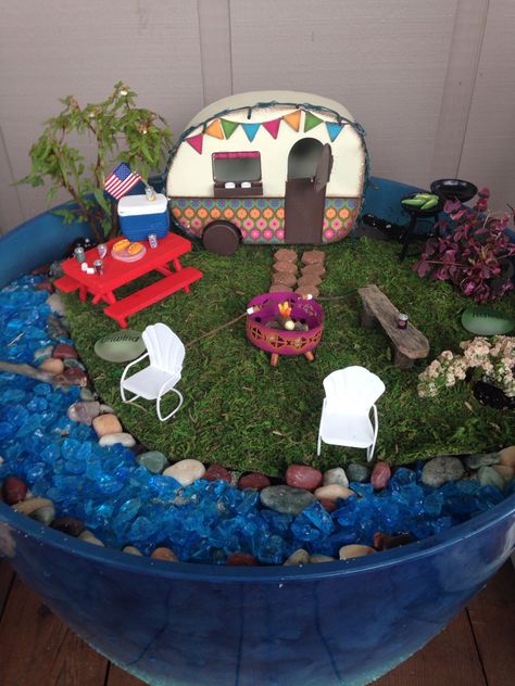 Camper fairy garden Small Fairy Garden Ideas, Camping Fairy Garden Ideas, Fairy Garden Ideas, Camping Fairy Garden, Fairy Garden Wheelbarrow Ideas, Beach Themed Fairy Garden, Hermit Crab Fairy Garden, Chinese Garden Design, Fairy Garden Camper