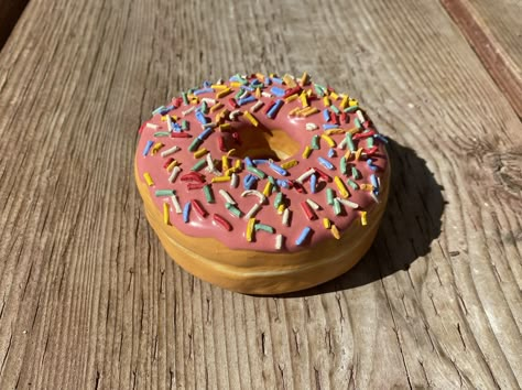 Here is the finished donut. I am really happy with this one. The first one I am really excited about. Donut Clay Art, Donut Pottery, Ceramic Doughnut, Pink Sprinkle Donut, Cruller Donuts, Clay Donut, Ceramic Donut, Donut Box, Donut Dessert