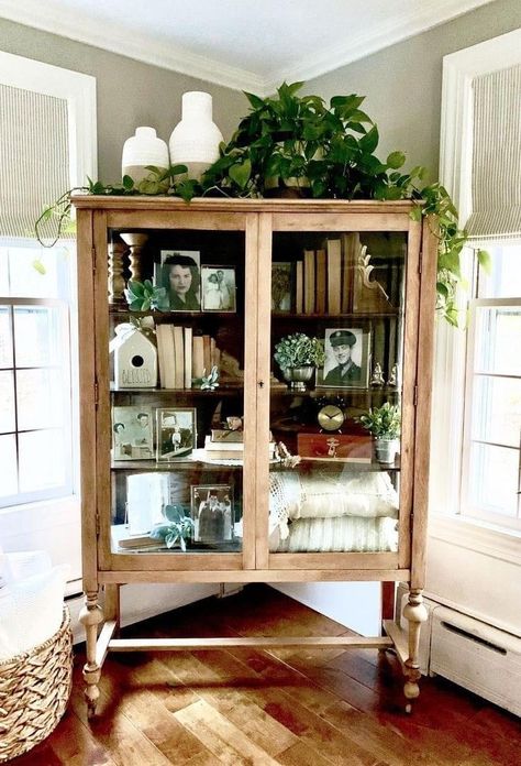 Decorating Armoire Tops, Vintage Two Door Cabinet, Decorating Top Of Buffet Cabinet, Green Modern Farmhouse Living Room, Large Wall Niche Decor Ideas, Display Case Makeover, Boho China Cabinet Display, Top Of Armoire Decor, Glass Cabinet Decor