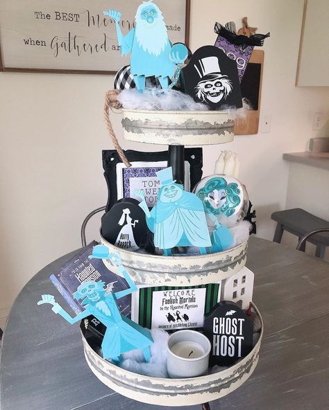 🌸Veronica Zamora on Instagram: “Halloween in our home is decorated in Disney style. Crafted a couple of elements to our tier tray using target items like tomb stones,…” Haunted Mansion Cake Disney, Haunted Mansion Tiered Tray, Tomb Stones, Manifesting Magic, Goth House, Magic Board, Disney Halloween Decorations, Goth Houses, Disney House