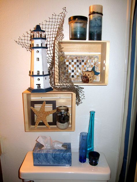 Beach themed shelves I just finished in my bathroom!!! Lighthouse Bathroom Ideas, Diy Beach Bathroom Decor, Beach Themed Bathroom Ideas, Lighthouse Theme, Lighthouse Bathroom, Beach Themed Bathroom, Beach Theme Bathroom Decor, Theme Bathroom, Themed Bathroom