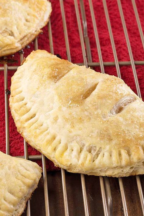 Whether you’re packing school lunches or serving up Sunday supper, surprise your loved ones with a batch of hand pies for dessert. Trust us- everything from the flaky, buttery crust to the cinnamon apple filling is on point. And they're baked rather than fried for a tasty twist on a classic. Get the recipe on Foodal. Easy Pie Desserts, Oven Baked Apple, Homemade Crust, Pbs Food, Hand Pie Recipes, Apple Hand Pies, Classic Apple Pie, Hand Pie, Apple Pie Recipe