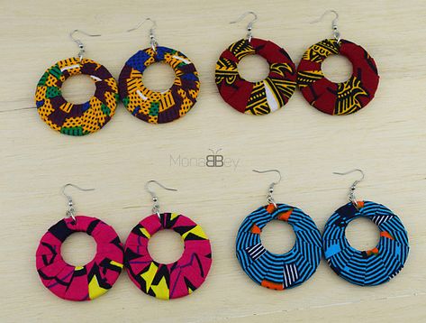 These earrings are made with African fabric and adorned with golden cowrie shells and tassel. Measurement ( approximately): 8 cm of diameter ____ Care: Do not sleep, bath or exercise while wearing this jewellery Stains can be removed gently with a damp cloth wet with warm soapy water. All Ankara Earrings, Gift Sets For Her, African Earrings, African Necklace, Fabric Earrings, Bangles Making, Fabric Necklace, Handmade African, African Print Fabric