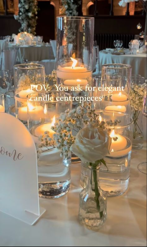 Floating Candles And Pillar Candles, Cream Centerpieces Wedding, Easy Elegant Wedding Centerpieces, Water Candles Wedding, Baby’s Breath With Floating Candles, Reception Table With Candles, Eucalyptus And Candles Wedding, Floating Candles Table Decor, Circle Wedding Centerpieces