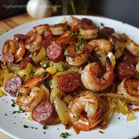 This Fried Cabbage with Shrimp, Sausage & Bacon combines smoky bacon, savory sausage, tender shrimp, and flavorful cabbage for a satisfying and easy-to-make dish. Seafood Cabbage Recipe, Southern Fried Cabbage With Sausage And Shrimp, Spicy Cabbage With Shrimp And Sausage, Cabbage Sausage And Shrimp Recipe, Fried Cabbage With Shrimp Sausage Bacon, Shrimp And Sausage Cabbage, Sausage Shrimp Cabbage Recipes, Fried Cabbage With Sausage And Shrimp, Shrimp Cabbage Recipes