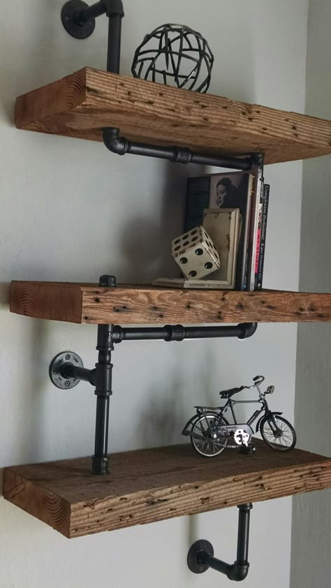 Floating Industrial Shelves, Black And Wood Industrial Bedroom, Industrial Wooden Shelves, Wooden Pipe Shelves, Rustic Industrial Shelves, Pipe And Wood Shelves Bathroom, Staggered Industrial Pipe Shelves, Pipe Furniture Wall Shelves, Mens Bedroom Shelving Ideas