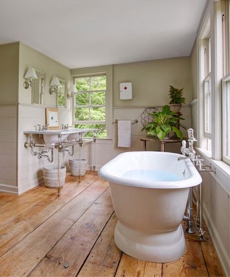 The wide floor planks in the master bath were salvaged from the original kitchen and sanded with a clear wax finish. A soaking tub from Waterworks anchors the room | archdigest.com Wood Floor Bathroom, Wood Floor Kitchen, Dream Farm, Set Sofa, Bad Inspiration, Country Bathroom, Gothic Revival, Master Bed, Wood Bathroom