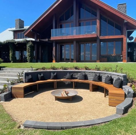 The most beautiful backyard fire pit ideas: Get inspired with our gallery, design tips, and where to shop the look! Oval Fire Pit Ideas, Semi Circle Fire Pit Area, Sunken Fire Pit Ideas Backyard, Covered Fire Pit Area, Circular Patio Ideas, Circle Fire Pit Area, Circular Fire Pit Area, Outside Fire Pit Ideas, Inbuilt Seating