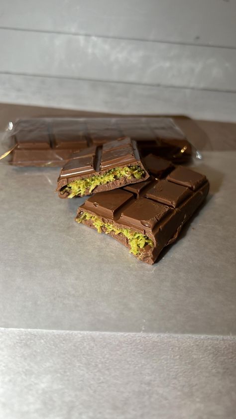 2 bar per order... *Made with the finest milk chocolate and natural ingredients, ensuring a rich and smooth texture. *Pistachio  *Nutella SHIPPING:  Ships in dry ice packs and insulated shipping mailer envelope bags to ensure the chocolate stays fresh and doesn't melt during the shipping and handling process. *chosing the slowest shipping time may cause your bars to still melt. We are not responsible for anything that melts *Expedited shipping is available so avoid melting. there is a seperate listing in my shop Pistachio Nutella, Kunafa Chocolate, Chocolate Snap, Bounty Chocolate, Dubai Chocolate, Fruit Chip, Chocolate Pack, Milk Chocolate Bar, Playstation Controller