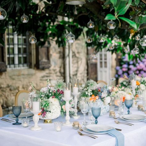 A Touch of Elegance for Your Special Day . Our wedding tablescape is designed to capture the beauty of romance with a perfect balance of soft, inviting hues. The delicate arrangement of flowers in blue, peach, and light orange brings a serene and dreamy atmosphere, setting the tone for an unforgettable celebration. Whether you're planning a chic, modern wedding or a timeless classic affair, these floral accents complement every style with their fresh and elegant charm. The soft blues evoke... Light Blue And Orange Wedding, Blue And Orange Wedding, Chic Modern Wedding, Arrangement Of Flowers, Dreamy Atmosphere, Wedding Tablescape, Orange Wedding, Blue Peach, Wedding Tablescapes