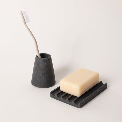 Simple, functional and beautiful. The toothbrush holder easily holds 1-2 standard size toothbrushes. Materials: concrete; toothbrush holders have a cork base Toothbrush Holder Dimensions: 2.5" w x 3" h Soap Dish Dimensions: 3.25" w x 4.75" l x 0.5" w Need a new brush? Try out our fully compostable toothbrush from Terra & Co. Need some soap to go with that? We love these. Our concrete work is all individually hand cast from custom made rubber molds. Colors are integrally mixed into the concrete a Concrete Toothbrush Holder, Air Dry Clay Toothbrush Holder, Clay Toothbrush Holder, Soap Holder Diy, Diy Soap Holder, Toothbrush Holder Ceramic, Pretty Ceramics, Clay Sinks, Tooth Brush Holder