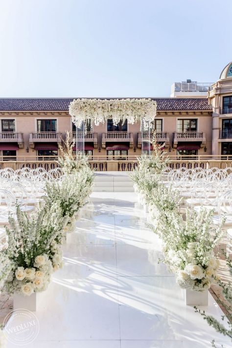 A Lavish White Wedding At The Beverly Wilshire - WedLuxe Magazine Walkway Flowers Wedding, White Aisle Wedding, Acrylic Wedding Arch, White Wedding Aisle, Modern White Wedding, Wedding Walkway, Elegant White Wedding, White Wedding Ceremony, White Wedding Decorations