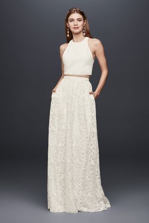 Perfect for every occasion leading up to the wedding, this two-piece outfit turns heads with a clean-lined, high-neck crepe crop top and a softly flowing lace maxi skirt.  DB Studio, exclusively at David's Bridal  Two-piece ensemble  Polyester  Back zipper; fully lined  Dry clean  Imported Boho Bridal Shower Dress, Reception Outfit For Bride, Maxi Skirt Formal, Wedding Crop Top, Crop Top Wedding Dress, Lace Maxi Skirt, Reception Outfit, Two Piece Wedding Dress, White Bridal Dresses