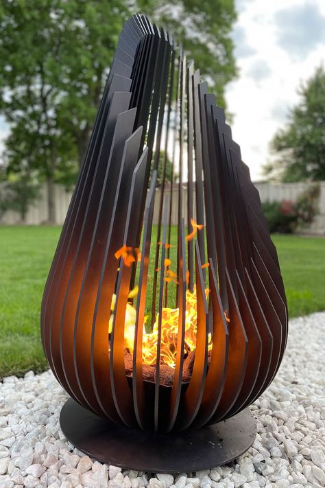 It combines sculptural metal art with a functional fire pit in the shape of a stunning giant teardrop. Fire Hearth, Metal Fire Pit, Wood Fire Pit, Fire Pit Ideas, Wood Burning Fires, Installation Design, Metal Art Projects, Firepit, Outdoor Fire