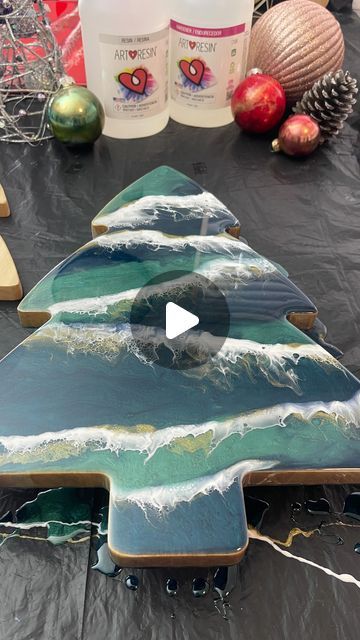 Lenore Ashmore 𝒜𝓇𝓉𝓌𝑜𝓇𝓀𝓈 & 𝒲𝑜𝓇𝓀𝓈𝒽𝑜𝓅𝓈 on Instagram: "✨ Creating Magic on a Christmas Tree Board! ✨

I had such a wonderful time crafting this beautiful Resin Christmas tree board! With a shimmery forest green and deep, glittery emerald, I added touches of metallic gold and white to create a snowy, festive look. Watching the cells form and the colours blend like snow falling on a winter tree was mesmerising! Created with food-safe Art Resin, this piece is perfect for serving or as unique holiday decor.

Looking for something special? I’m open for custom commissions and offer Resin and Ink workshops in Sydney and online—let’s make your ideas come to life!

Worldwide shipping | Resin & Ink Workshops Sydney & Online" Christmas Tree Board, Resin Christmas Tree, Cell Forms, Resin Christmas, Unique Holiday Decor, Snow Falling, Winter Tree, Festive Look, Art Resin