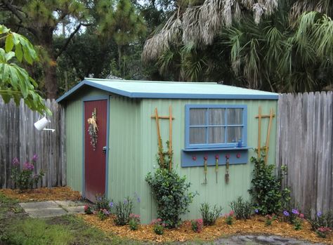 backyard shed makeover - My Repurposed Life™ don't like the colours but I like the window shelf and trelises. Painted Shed, Shed Makeover, Cheap Sheds, Large Sheds, Diy Shed Plans, Storage Shed Plans, Easy Backyard, Backyard Sheds, Backyard Shed