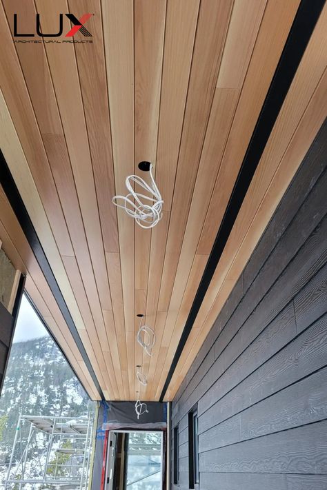 Metal woodgrain architectural siding & soffit Wood And Metal Siding Exterior, Soffit Exterior, Dark Fascia And Soffit, Cladding Ceiling, Wood Look Soffit Exterior, Wood Soffits, Wooden Soffit, Modern Soffit Exterior, Exterior Soffit Ideas