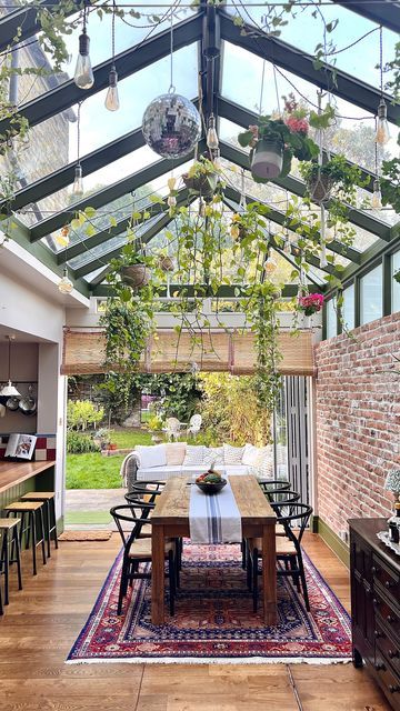 Meg Lambert on Instagram: "• the brief • @petershamnurseries but make it *kitchen*🍃 It took: ~ 10 months ~ A few breakdowns ~ 5000 tins of @lick paint ~ Multiple measuring mistakes ~ And approx 32,847 cups of coffee But we managed to transform this white box conservatory into our kitchen of dreams 🤍 I didn’t just want to bring the outdoors in, I wanted it to *feel* like the outdoors, indoors. A few more plants to go(😰) but I think we’re just about getting there. Follow for more of White Conservatory Ideas, Crittal Style Conservatory, Conservatory Dining Table, Kitchen With Garden Doors, Glass Kitchen Extension, Upvc Conservatory Makeover, Atrium Dining Room, Conservatory Dining Room Ideas, Kitchen Conservatory Extension