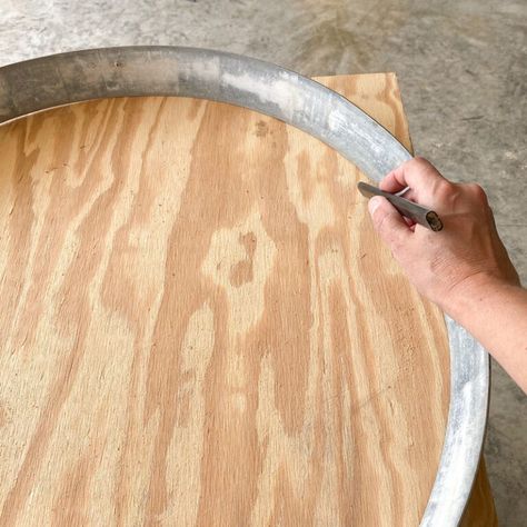 DIY bourbon barrel ring serving tray | Chica and Jo Wine Barrel Ring Ideas Diy Metal, Ideas For Barrel Rings, Metal Barrel Rings Ideas, Whiskey Barrel Rings Ideas, Wine Barrel Ring Ideas Diy, Barrel Rings Repurposed, Barrel Ring Art, Bourbon Barrel Ring, Barrel Crafts