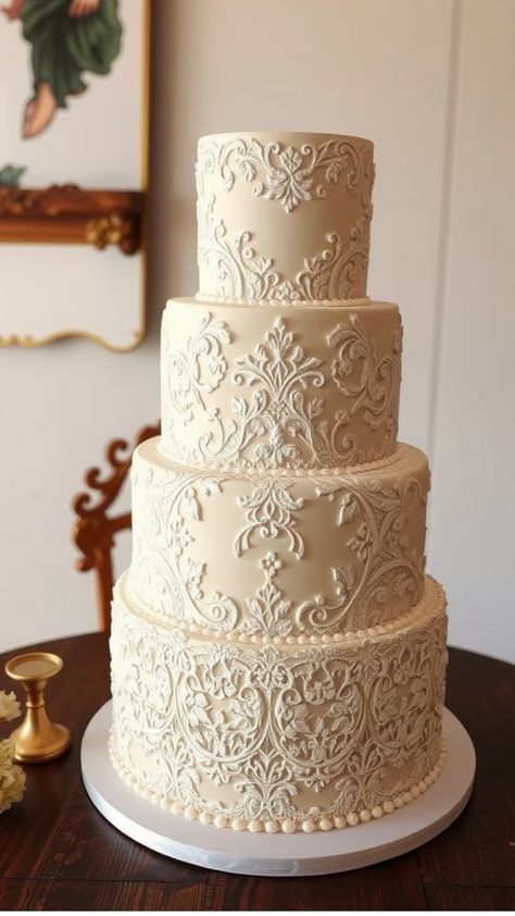 Elegant four-tiered white wedding cake with intricate floral patterns on a wooden table. Wedding Cakes For 200 Guests, Pale Yellow Wedding Cake, November Wedding Cake, Old Money Wedding Cake, Classic Wedding Cake Vintage, Korean Wedding Cake, Vintage Style Wedding Cake, Simple Elegant Wedding Cakes, Wedding Cake Pattern