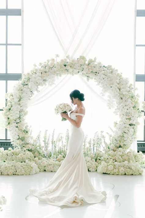 All White Flower Arch, Circular Floral Arch Wedding, All White Wedding Arch, White Floral Arch Wedding, Circle Flower Arch, Wedding Arch White Flowers, White Wedding Arches, Round Floral Arch, Round Ceremony Arch