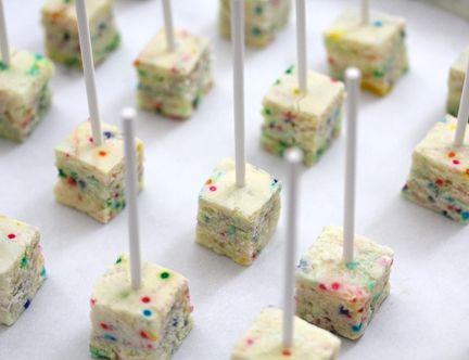 Funfetti Cheesecake Pops ~ That's funfetti inside and out! It’s fun, it’s colorful, it's funfetti cheesecake pops dipped in white chocolate with a chocolate pour and finished with nonpareils and jimmies, topping all that goodness off is a red M&M for good cheer. Funfetti Cheesecake Pops I am a sucker for food on a stick. Food plus stick usually equals tasty bites. Aside from that, you know me and my love for cute food–and food on a stick is always cute! Make it a cheesecake pop an... Square Cake Pops, Funfetti Cheesecake, Cheesecake Pops, Square Cake, Cheesecake Bites, Yummy Sweets, Cakepops, Mini Desserts, Sweets Treats