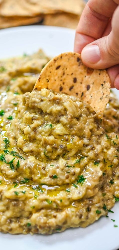 This Roasted Eggplant Dip is creamy, flavorful, and perfect for serving at parties or for a snack. This dish is so easy to make and tastes great with everything you serve it with. Creamy Eggplant, Eggplant Dip Recipes, Vegan Eggplant Parmesan, Potluck Meals, Babaganoush Recipe, Chinese Chicken Salad Recipe, Roasted Eggplant Dip, Creative Dinner Ideas, Spreads And Dips