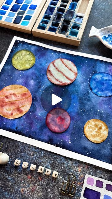 Mayo Moreno|Watercolor Artist on Instagram: "Planets playing to find their place in the galaxy 🤍🌌 🪐  #planets #galaxy #crafts #watercolors #artoftheday #artreels #creativehappylife #artlove #chicagoartist" Planet Painting, Chicago Artists, Planets Art, Art Lessons For Kids, Painting Lessons, Watercolor Artist, Art Classroom, Art Education, Art Day