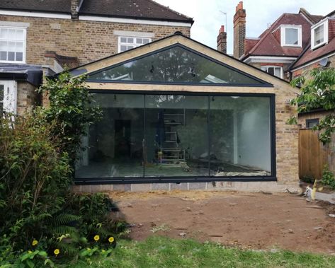 Virtually Frameless 20mm sliding door with large fixed frame gable apex with solar glass finished and cladded in aluminium.  #moderndesign #homerenovation #myrenovation #homeimprovements #granddesign #slidingdoors #gableroof #kitchenextension #renovation Apex Extension, Gable End Extension, Small House Extensions, Folding Sliding Doors, Frameless Sliding Doors, Gable Window, Bungalow Extensions, Garden Room Extensions, House Extension Plans