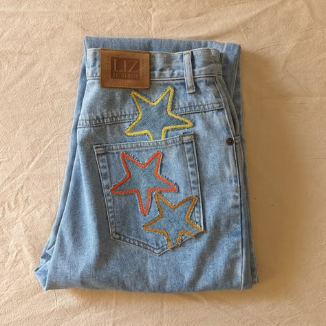 "Reworked vintage light wash mom jeans. These jeans are reworked with handmade star patches in a mainly yellow and orange color pallate.  All pockets are fully functional.  Original jeans are by Liz Wear. 100% cotton, made in Phillipines.  Marked a size 10 Petite- 29\" waist, 11.5\" rise, 39\" hips, 26\" inseam, 14\" leg opening.  In great vintage condition with some very light vintage wear." Patchwork Star, Light Wash Mom Jeans, Star Patches, Reworked Denim, Patchwork Clothes, Diy Jeans, Vintage Mom Jeans, Thrift Flip, Reworked Vintage