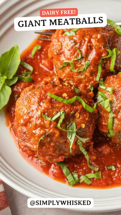 Outshine ordinary meatballs and go big with these extraordinary, giant meatballs baked in tomato sauce. These hearty and robust meatballs are larger than life and packed with incredible flavors. Smothered in a classic Italian tomato sauce, these meatballs can be served with or without your favorite pasta. Meatballs No Tomato Sauce, Tomatoe Sauce Meatballs, Rao's Meatballs With Marinara Sauce, Tomato Sauce For Meatballs, Baked Ziti With Ricotta, Baked Italian Meatballs, Classic Meatballs With Tomato Sauce Food Network, Italian Meatballs Recipe, Italian Tomato Sauce